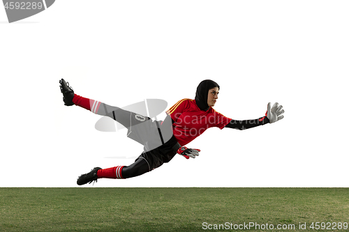 Image of Arabian female soccer or football player, goalkeeper on white studio background