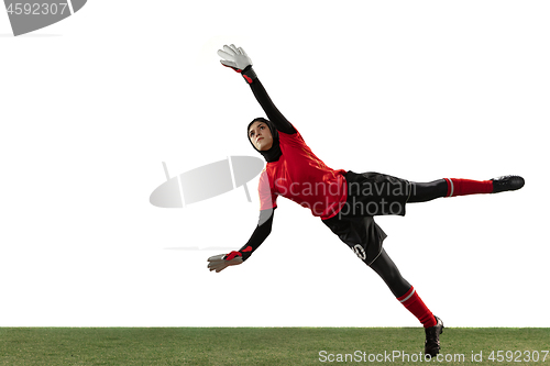 Image of Arabian female soccer or football player, goalkeeper on white studio background