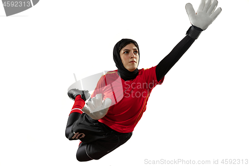 Image of Arabian female soccer or football player, goalkeeper on white studio background