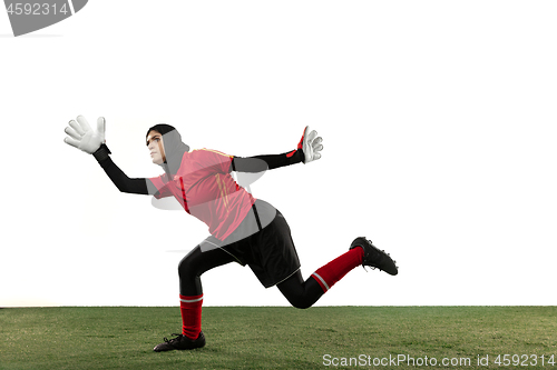 Image of Arabian female soccer or football player, goalkeeper on white studio background