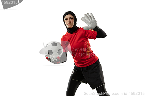 Image of Arabian female soccer or football player, goalkeeper on white studio background