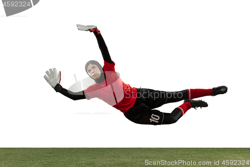 Image of Arabian female soccer or football player, goalkeeper on white studio background