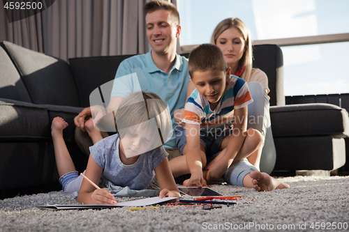 Image of young couple spending time with kids