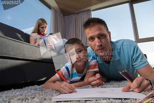 Image of young couple spending time with kids