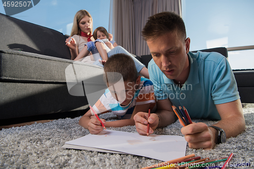 Image of young couple spending time with kids