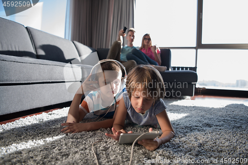 Image of couple spending time with kids