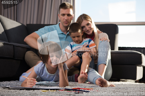 Image of young couple spending time with kids