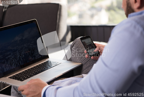 Image of man working from home