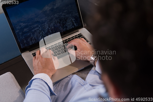 Image of man working from home