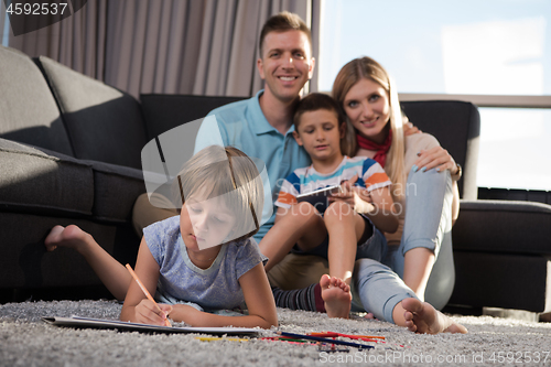 Image of young couple spending time with kids