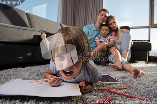 Image of young couple spending time with kids