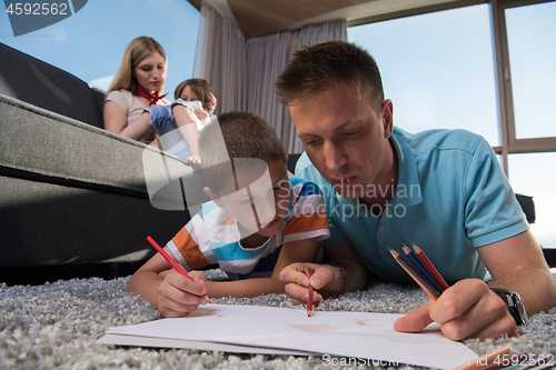 Image of young couple spending time with kids