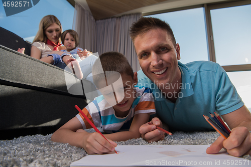 Image of young couple spending time with kids
