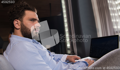 Image of man working from home