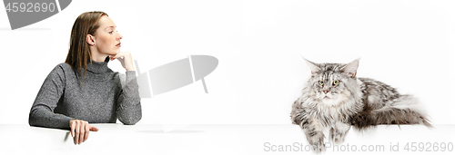 Image of Woman with her cat over white background