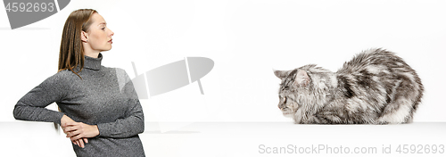 Image of Woman with her cat over white background