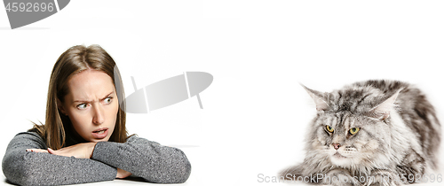 Image of Woman with her cat over white background