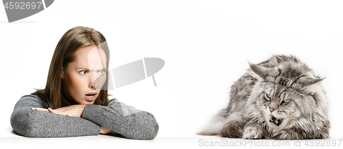 Image of Woman with her cat over white background