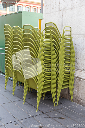 Image of Stacked Chairs Outside