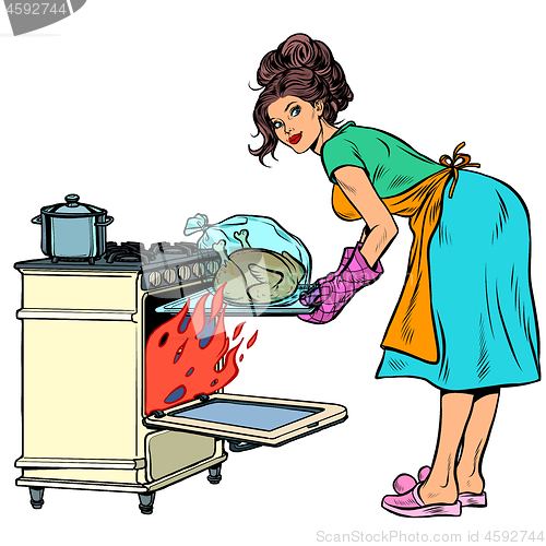 Image of Woman housewife bakes bird in the oven