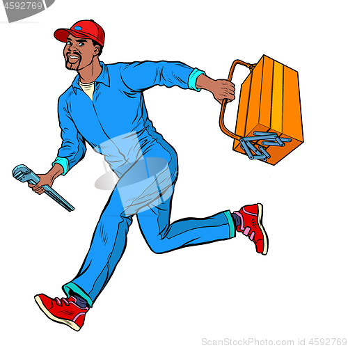 Image of Male African master repairman runs