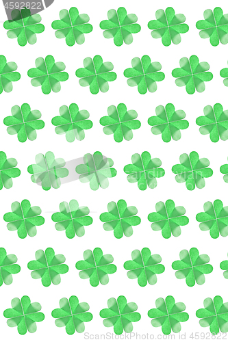 Image of Vertical holiday background from paper clover\'s leaves.