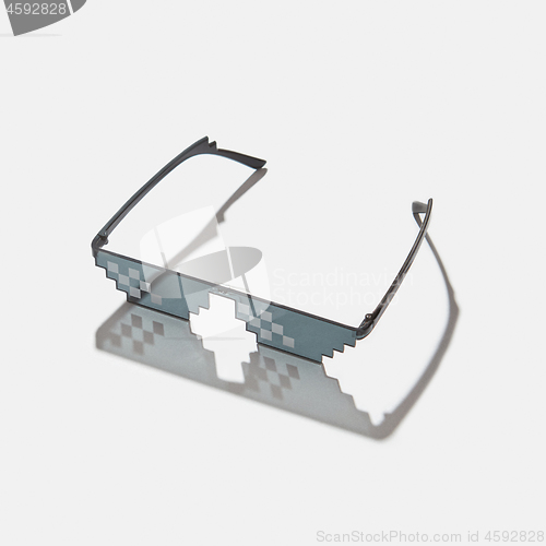 Image of Pixel art glasses on with hard shadows.