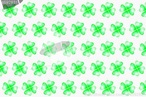 Image of Pattern from green splashes in the shape of clover leaves.
