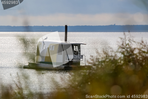 Image of Floating sauna with seagul in the sea.