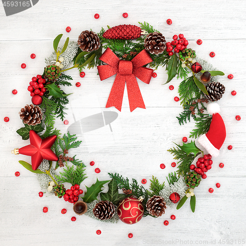 Image of Christmas Wreath with Red Bow and Winter Flora