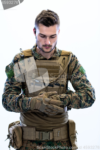 Image of closeup of soldier hands putting protective battle gloves