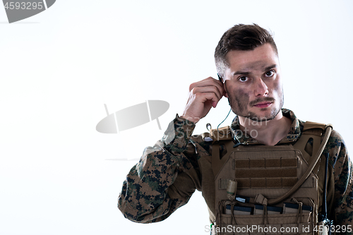 Image of soldier preparing gear for action