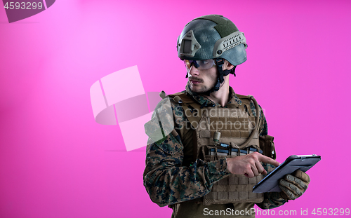 Image of soldier using tablet computer closeup