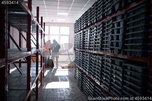 Image of team of mining  workers measuring drilled rock core