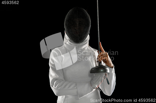 Image of Teen girl in fencing costume with sword in hand isolated on black background