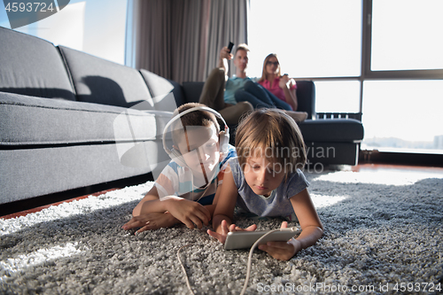 Image of couple spending time with kids