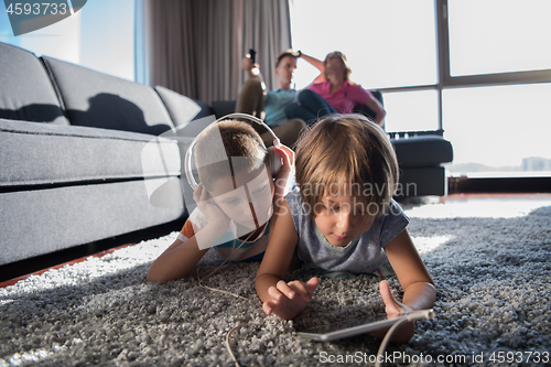 Image of couple spending time with kids