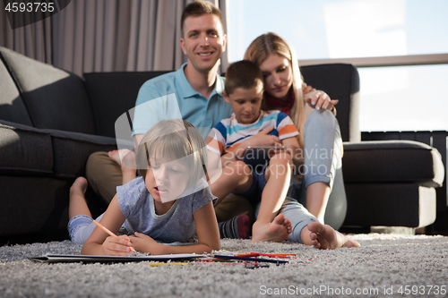 Image of young couple spending time with kids