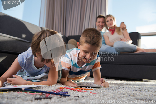 Image of young couple spending time with kids