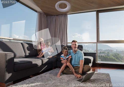 Image of Happy family playing a video game