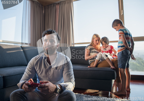 Image of Happy family playing a video game