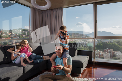 Image of Happy family playing a video game