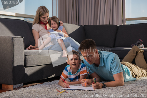 Image of young couple spending time with kids