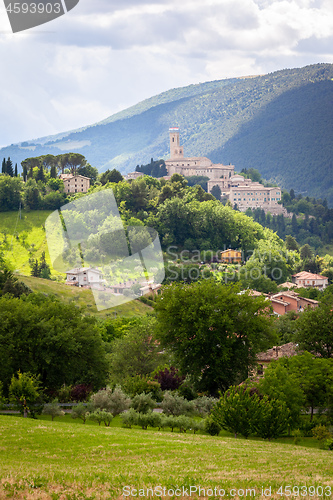 Image of Camerino in Italy Marche over colourful fields