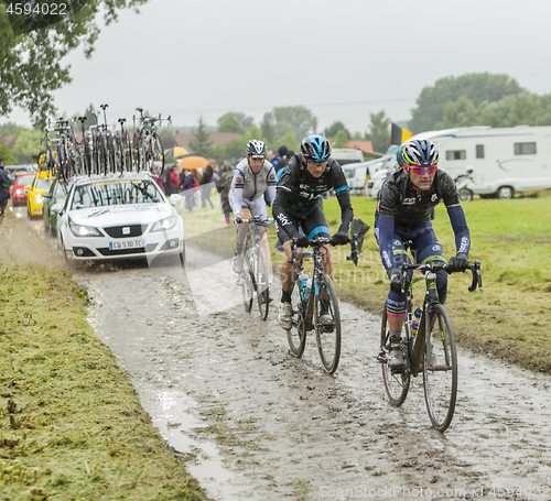 Image of Group of Cyclists on a Cobblestone Road - Tour de France 2014