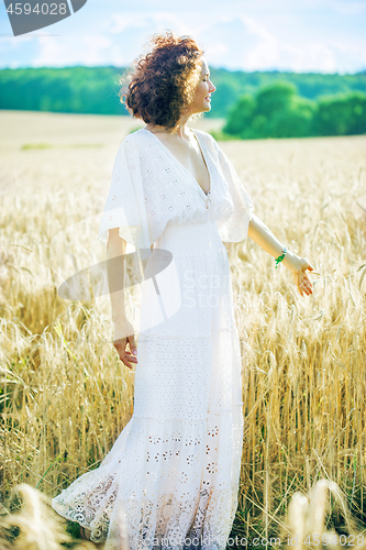 Image of beautiful  woman in the field