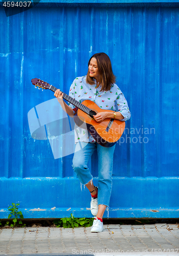 Image of woman with a guitar 