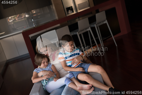 Image of young mother spending time with kids