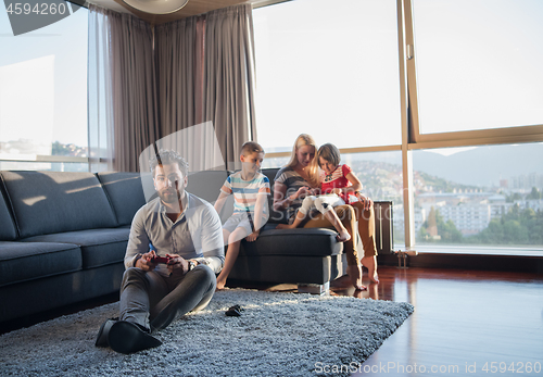 Image of Happy family playing a video game