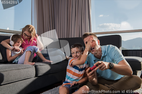 Image of Happy family playing a video game